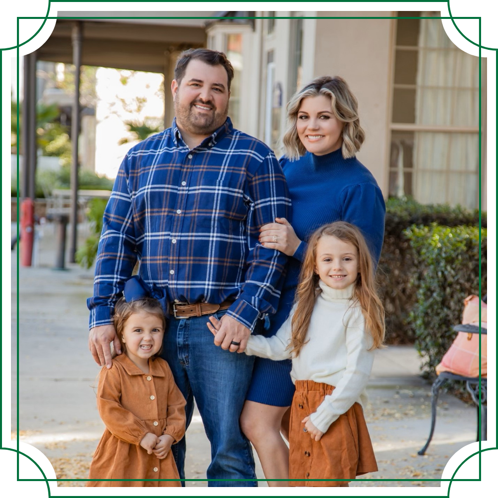 posed family portrait of the owner of armentor glassworks, his wife, and 2 daughters