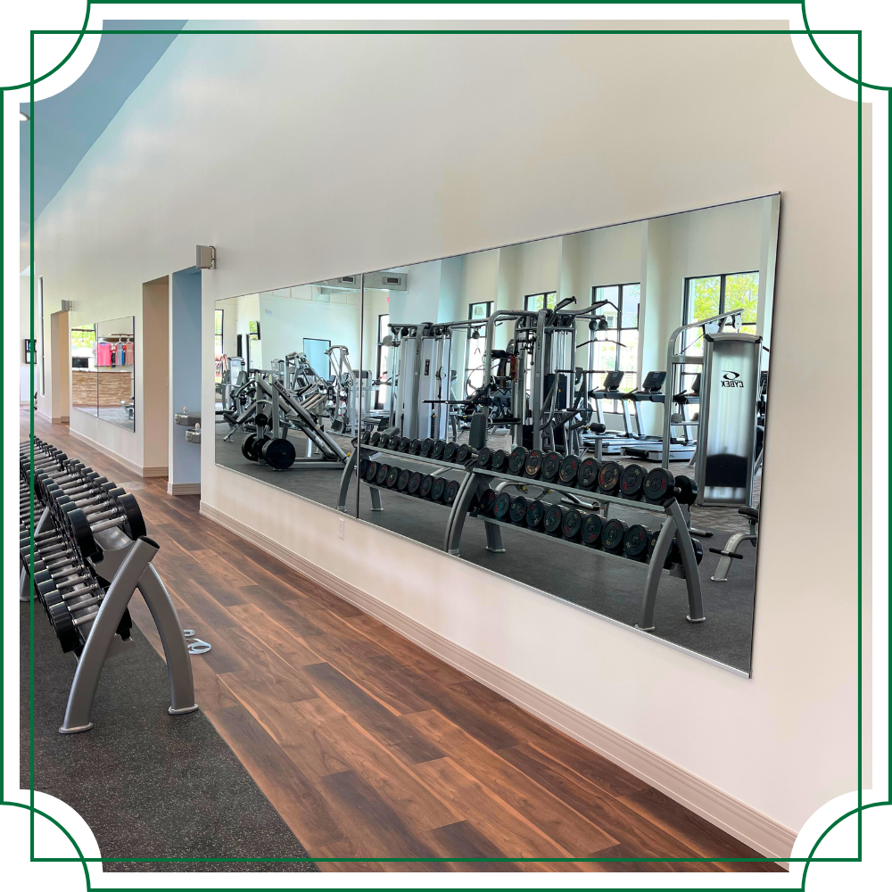 a large mirror wall installed at a gym